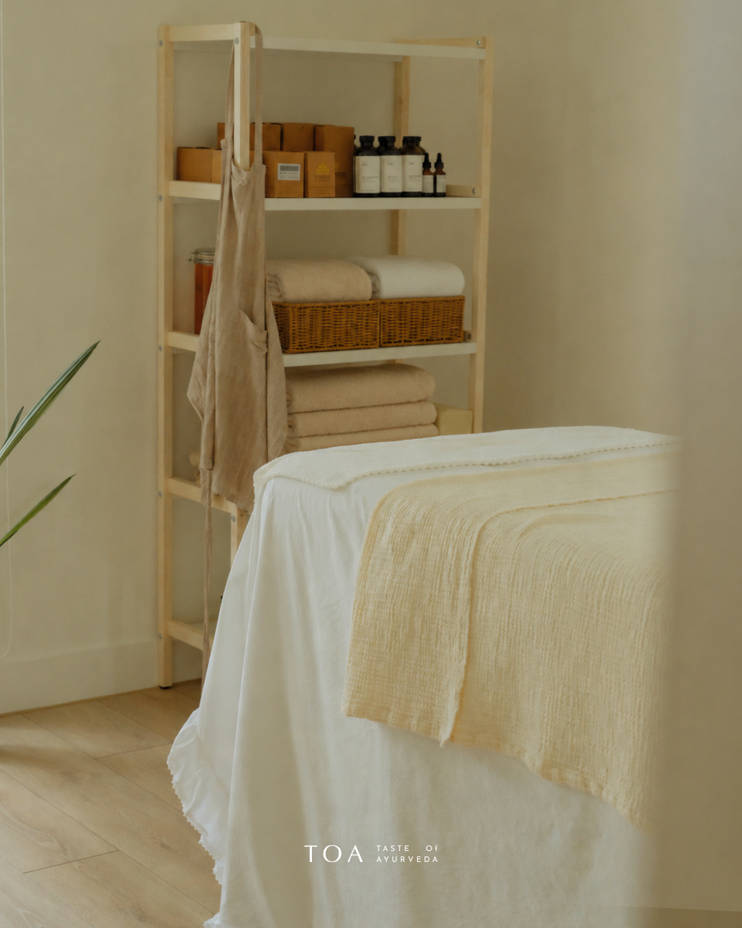 Studio with wooden table and folded linen